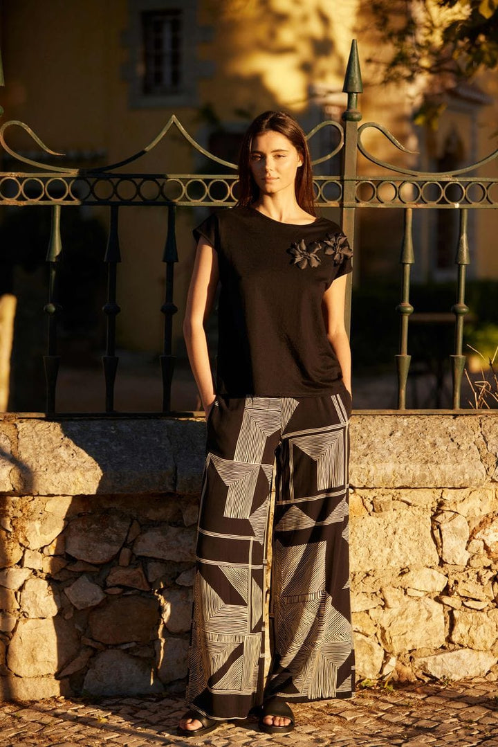 Peruzzi Schwarze und goldene geometrische Weitbeinhose