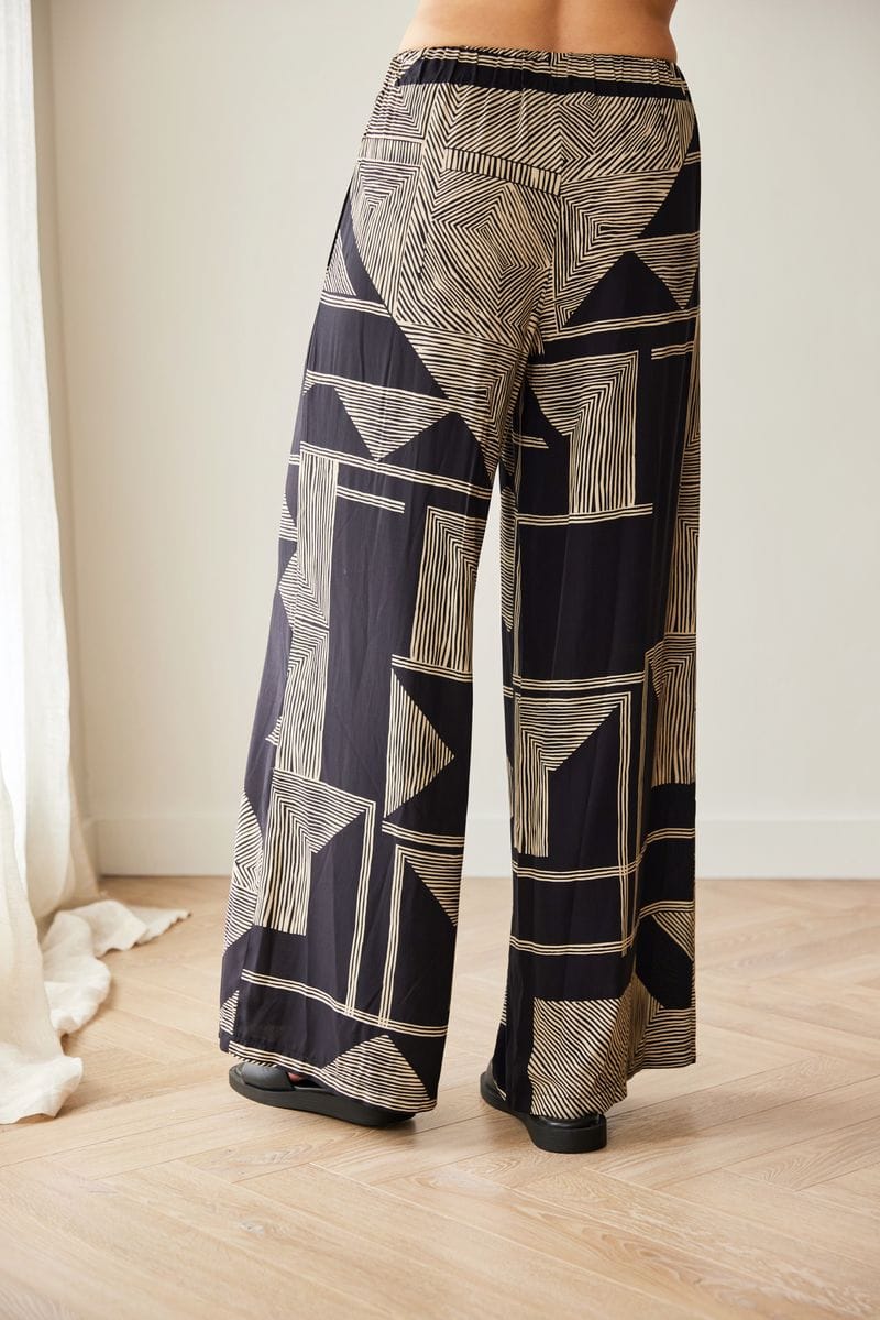 Peruzzi Schwarze und goldene geometrische Weitbeinhose
